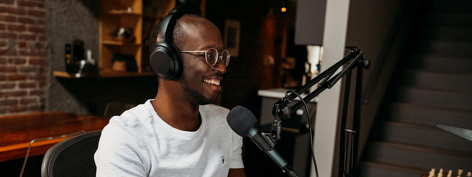 Man with headset and microphone in front of him